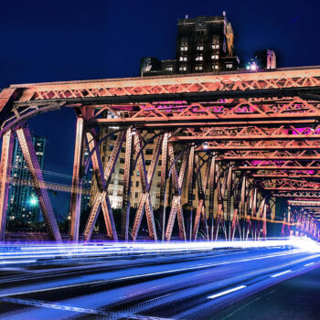 Light trails of traffic on busy bridge