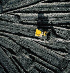 Open pit mine. Aerial view of extractive industry for coal. Top view. Photo captured with drone.