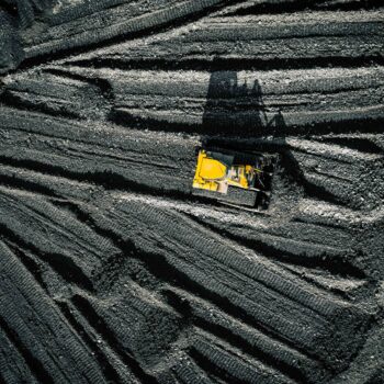 Open pit mine. Aerial view of extractive industry for coal. Top view. Photo captured with drone.