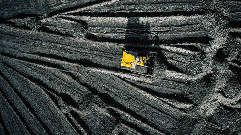 Open pit mine. Aerial view of extractive industry for coal. Top view. Photo captured with drone.
