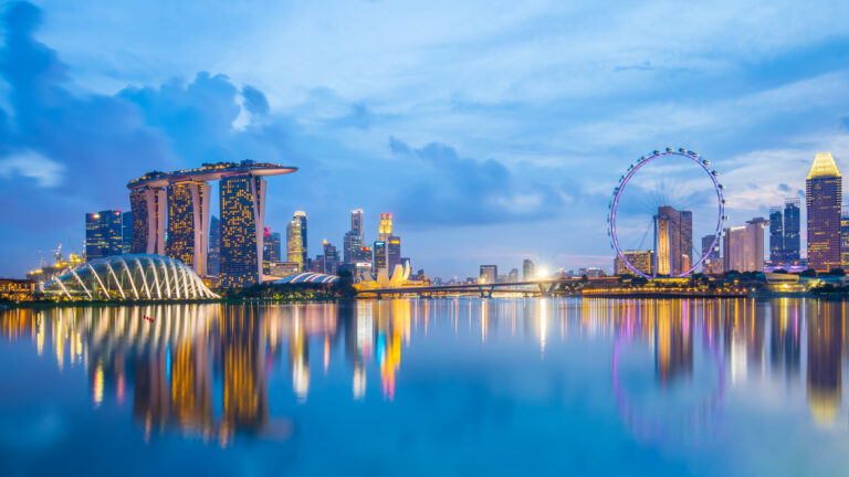 Singapore Skyline and view of Marina Bay at twilight.