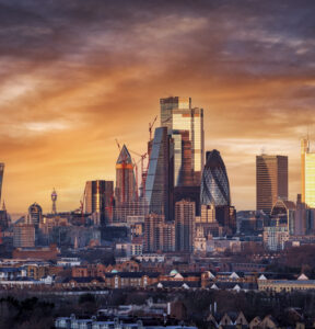 Elevated, panoramic sunrise view of the skyline of London City with the various modern skyscrapers reflecting the soft morning sunlight