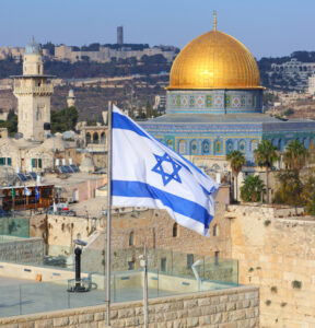 Jerusalem Old City with Dome of the Rock and flag of Israel.