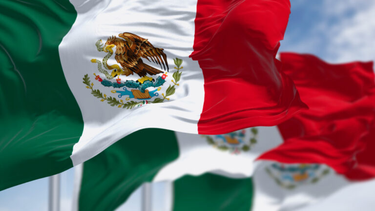 Three Mexican national flags waving in the wind