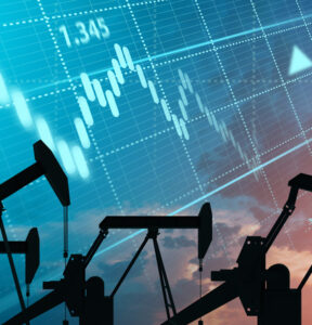 Silhouette of an oil production company. Natural resource extraction. Oil rigs against the evening sky.